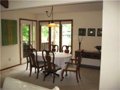 Dining Room: Corner glass captures lake view east. Only three homes exist on cul de sac of exclusive homes projecting north into Foxcliff Lake East.