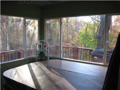 Sun Room: Enclosed sun rm. Hot tub may be available. View through S/W corner of main level home toward mature woods, ravine, pond in common area. Wrap deck. Very private.