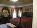 Master Bedroom: Corner glass. Dome ceiling. Crown moldings. Custom draperies match bed spread. For sale or not included in sp.