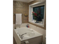 Master Bath/Spa: Platform wrpl tub with tile surround. Seperate shower.