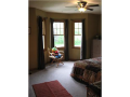 Two of the upper bedrooms have bay window shaped sitting areas.