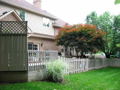 Privacy screen shelters in deck hot tub. Storage exist, a partial fenced yard, and abundant open yard edged by pines and hardwoods with passage to spillway creek.