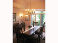 Ceiling tray. Arched window glass views formal entry garden.