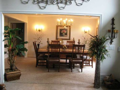 Formal dining off entry foyer. Invitational to living rm guest. Circular plan for kitchen access, but removed and private from visible or kit work area. Natural light front view to landscaped entry gardens. Ceiling sculpture.