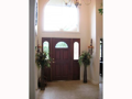 Two story foyer. Tiled entry through back hall to laundry & powder bath.