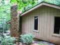Exterior Back: Siding mixes T-1-11 @ 12" centers, flashed, painted @ 5/8ths thickness with cedar trim. Hot tub wire (work in progress) will have disconnect box and "J" box for outside electrical. Other exterior accents feature sandstone.