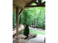 Porch: Entry porch w concrete floor. Heavy timber Colorado lodge style design with vaulted ceiling. Knotty pine car siding under roof. Classic with style and function. Expensive.